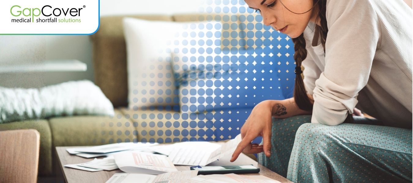 woman-reviewing-medical-bills-at-home-managing-healthcare-costs-and-medical-aid-shortfalls